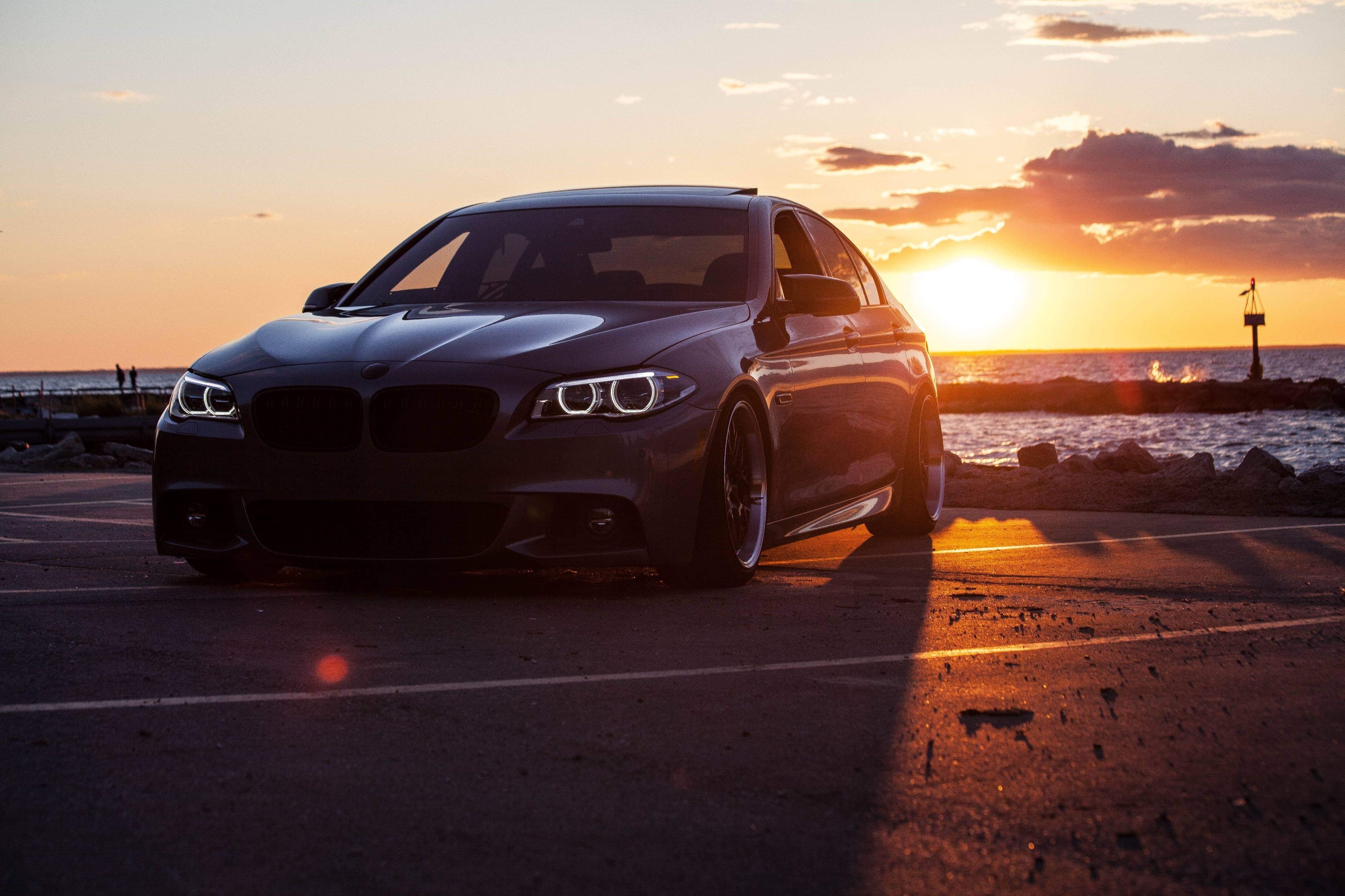 car-parked-by-the-water-at-sunset.jpg