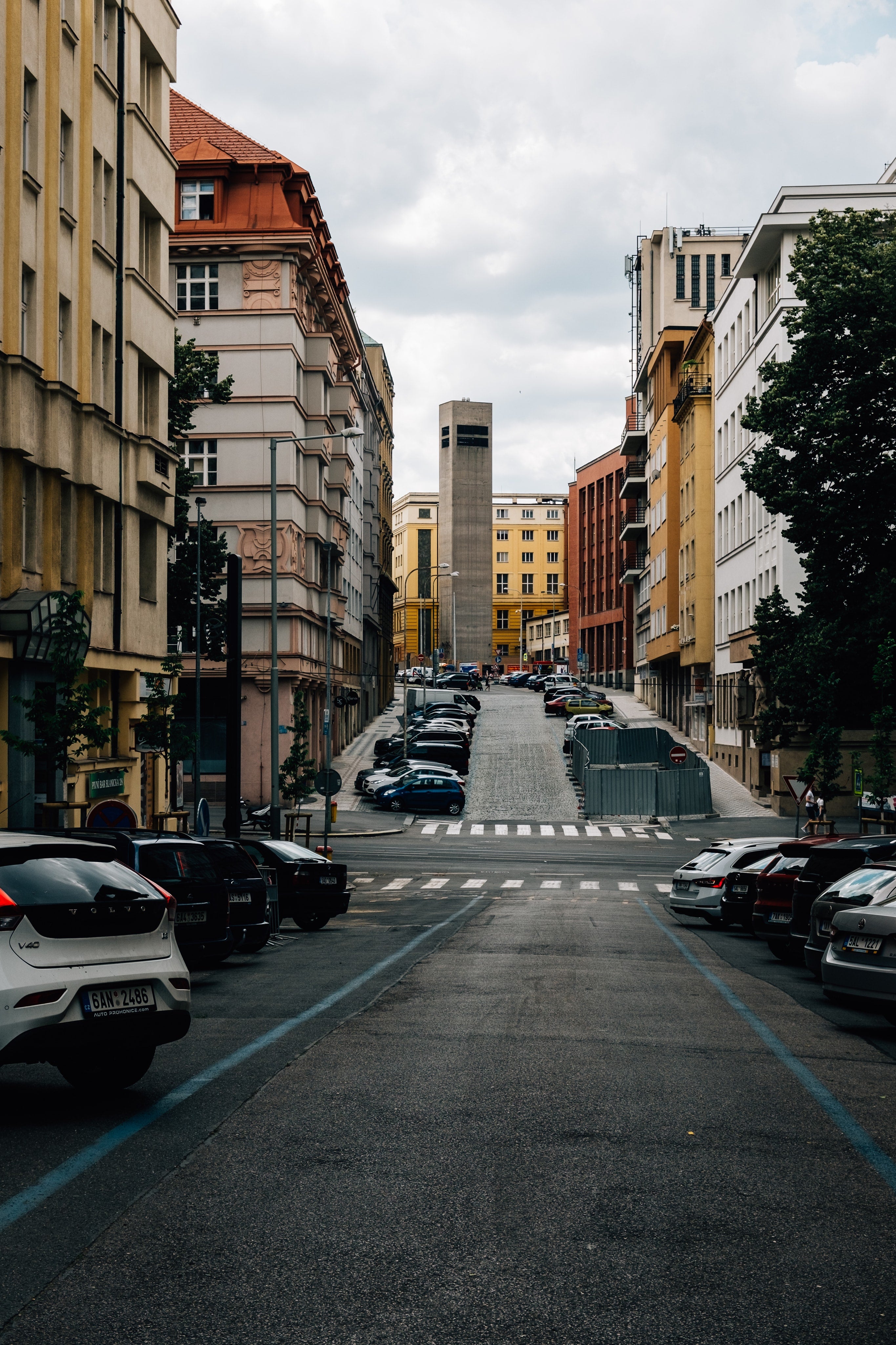 quiet-city-street-lined-with-colorful-buildings-and-parked-cars-2.jpg